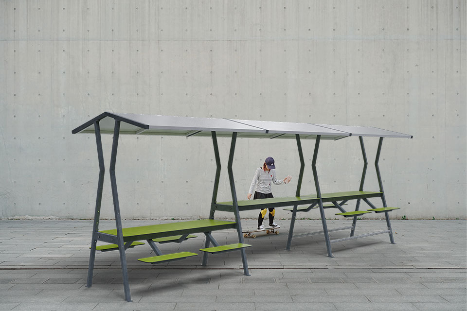 Roofus - modulair meubilair met overdekte zithoek. Een stevige tafel en bank in combinatie met een licht gekleurde stalen overkapping
